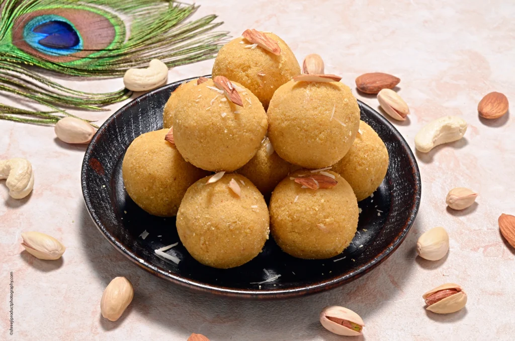 Besan Laddu in a Black Plate – product photography by Shreeji, Nagpur