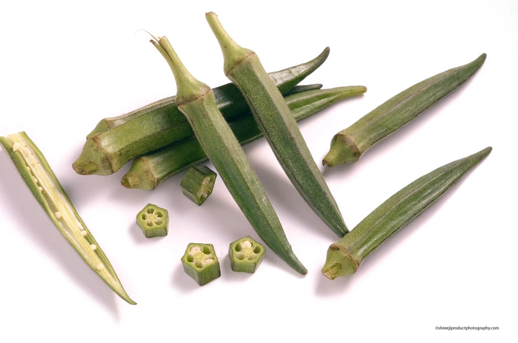 Fresh Bhindi on White Background – product photography by Shreeji, Nagpur