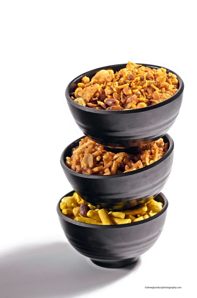 Khatta Meetha Namkeen in a black bowl – product photography by Shreeji, Nagpur