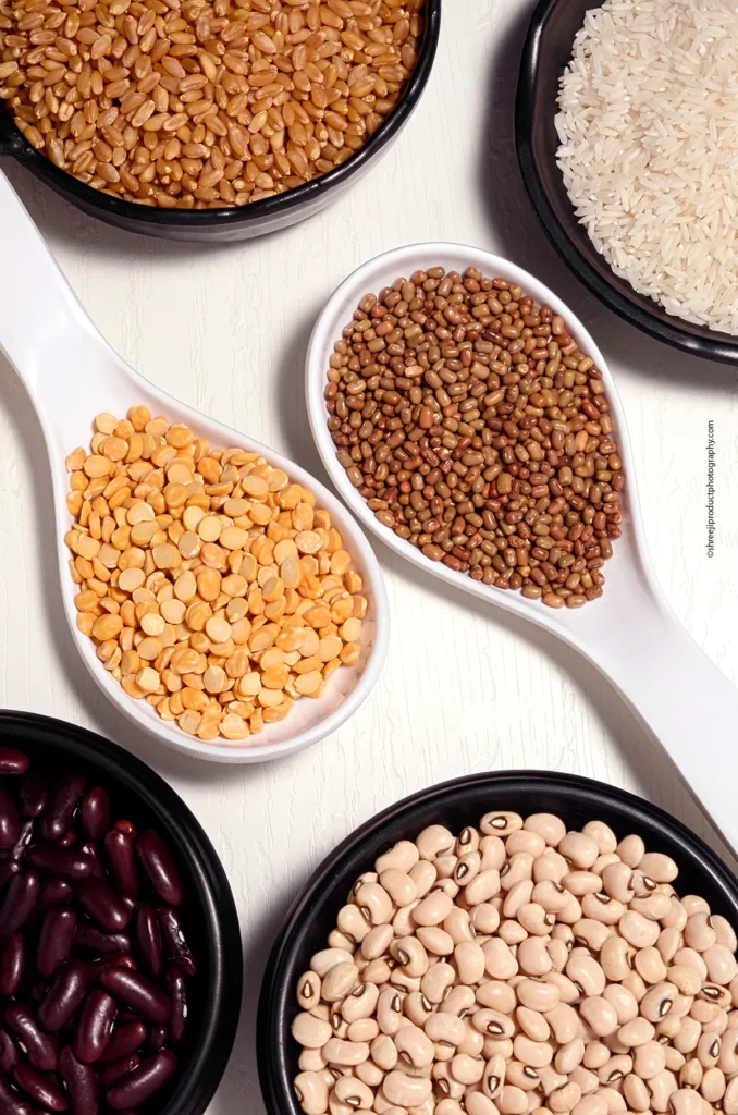 Whole Grains on black bowls – product photography by Shreeji, Nagpur